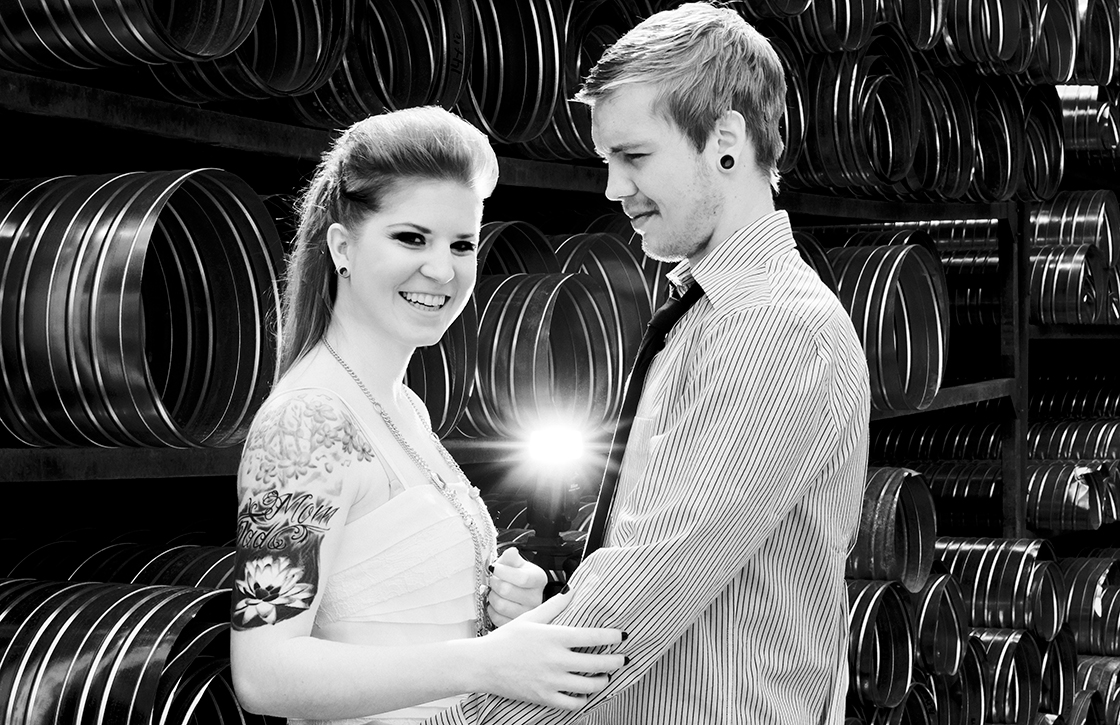 Rock and roll wedding, industrial metal background with happy couple, by Kootenay Wedding Photographer Electrify Photography